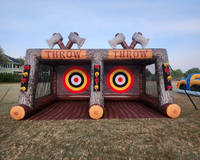Inflatable axe throwing game rental for corporate events in Charleston, SC, featuring targets and a